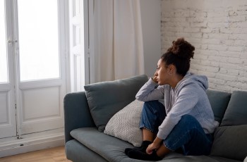 Woman sitting on sofa