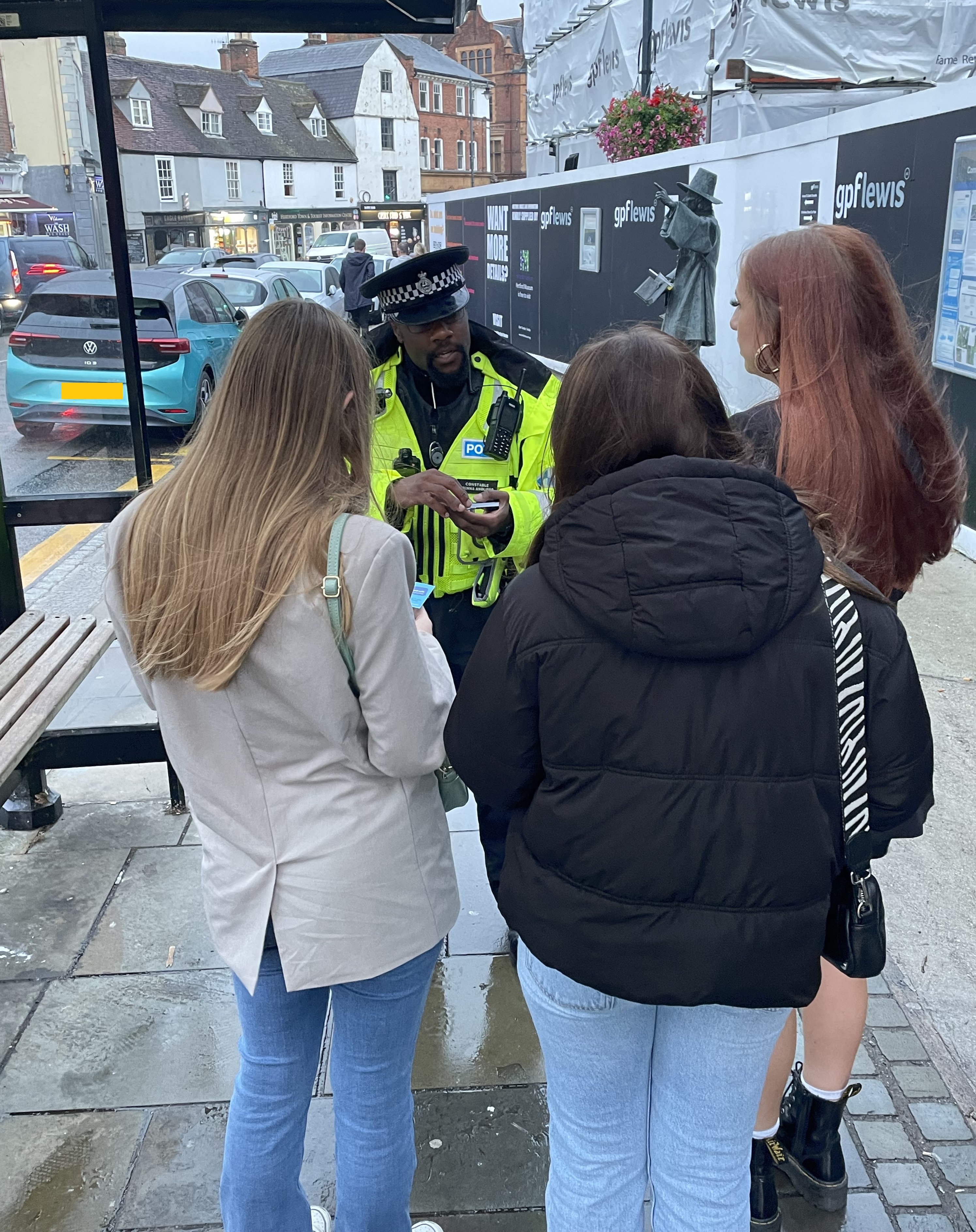 Image of officer speaking with members of the public