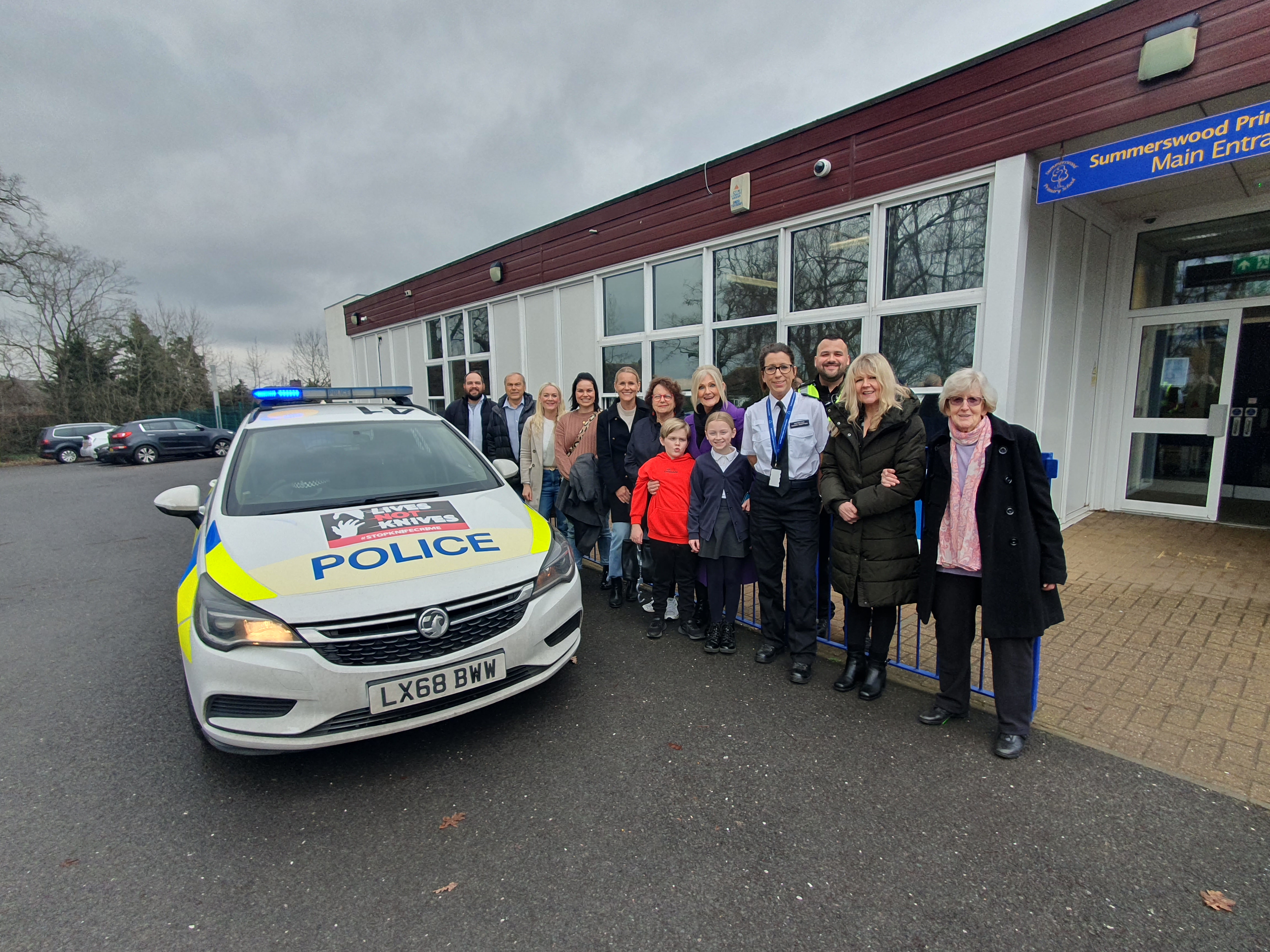 Photo of Luke and his family with Inspector Robertson and PC Luke Ellis