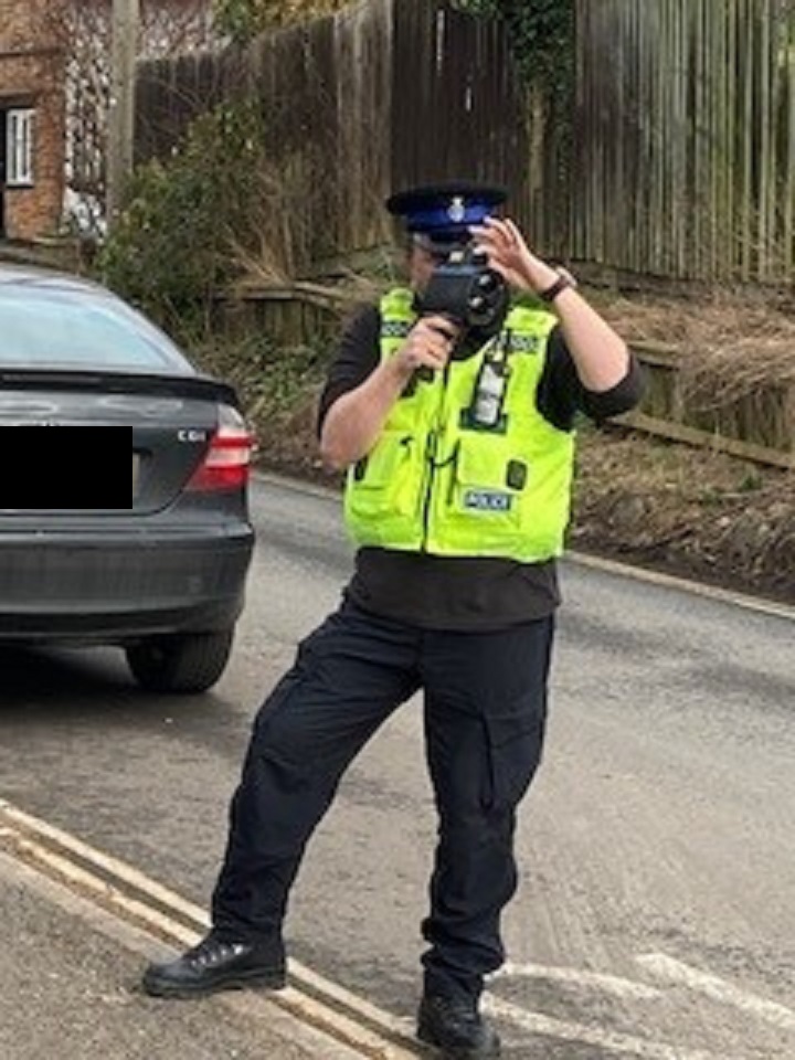 Officer using a speed indication device 