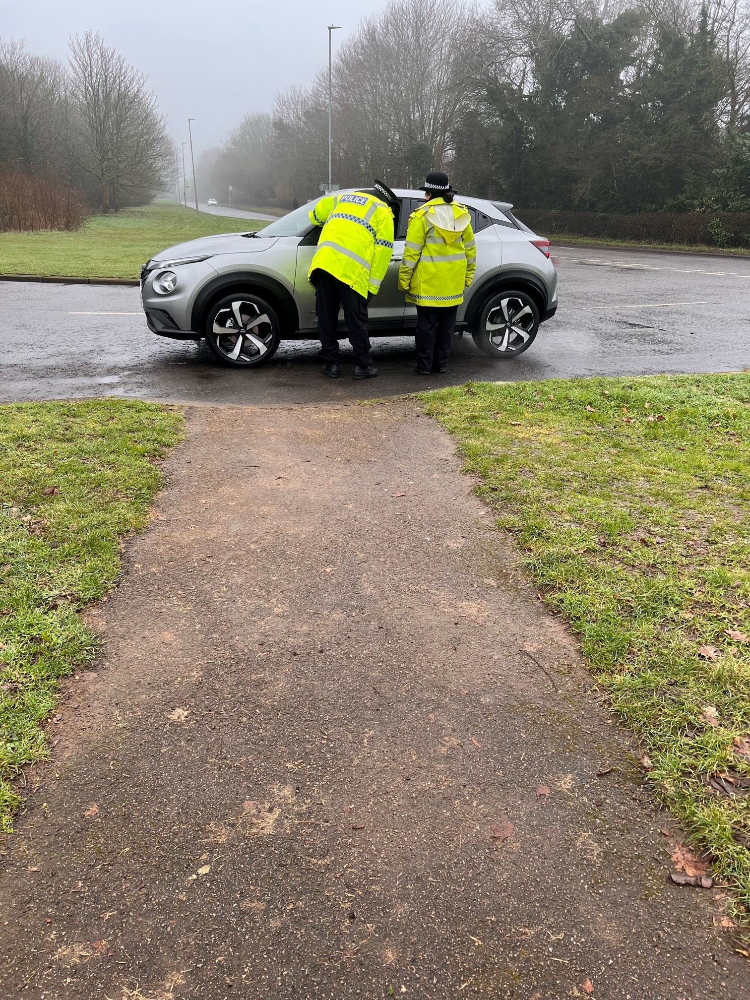 Officers talking to a driver