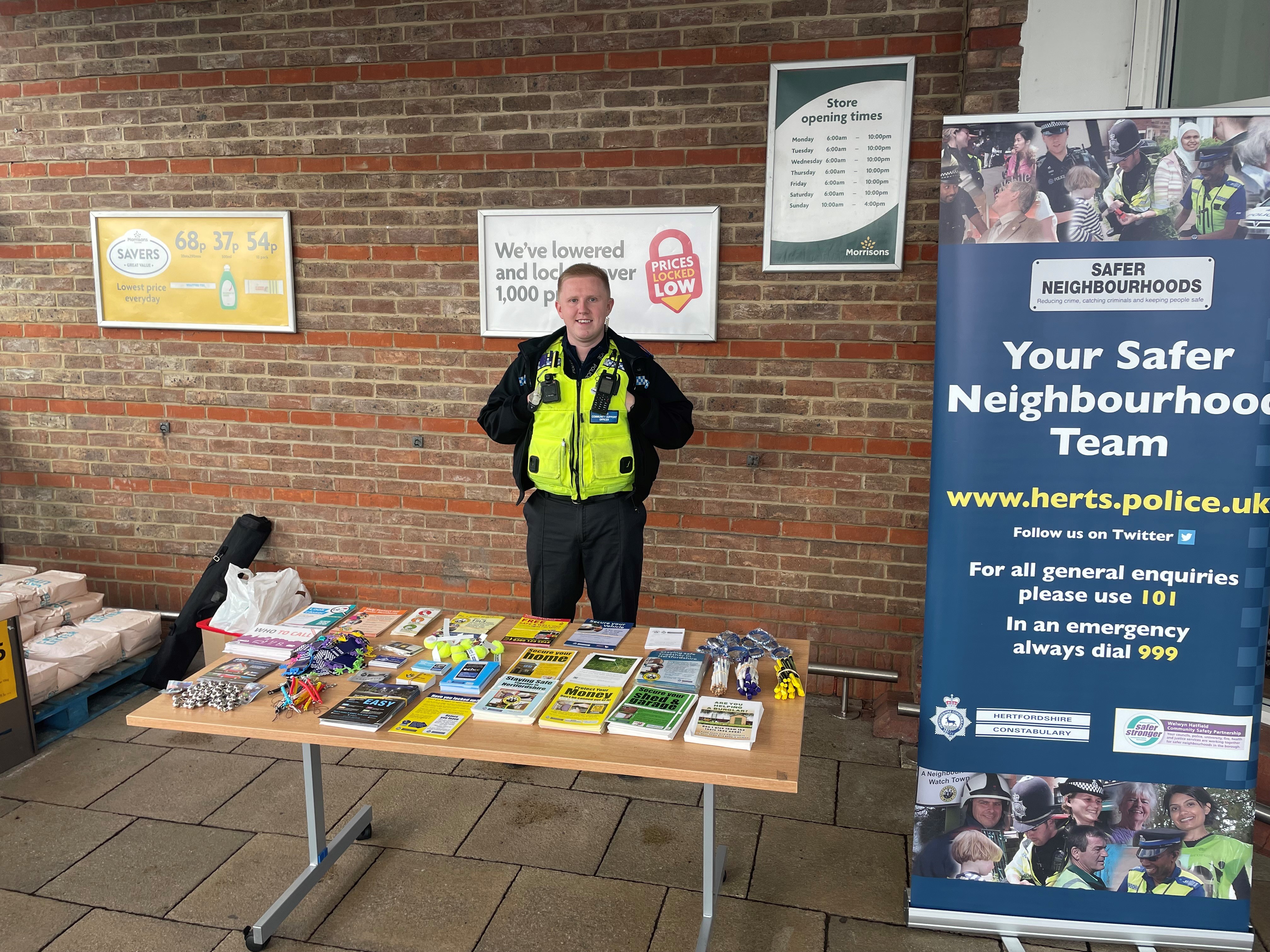 Police crime prevention stall with officer