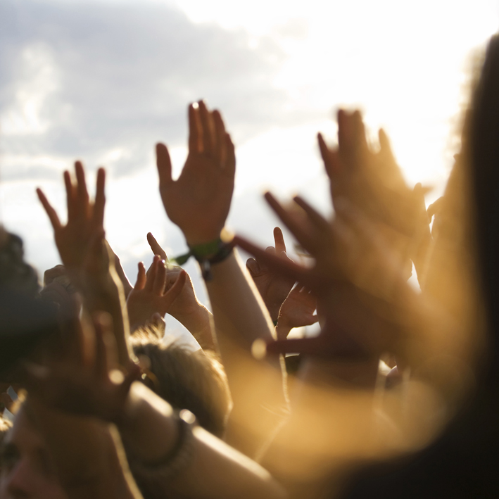 Generic image of hands up in the air at a festival
