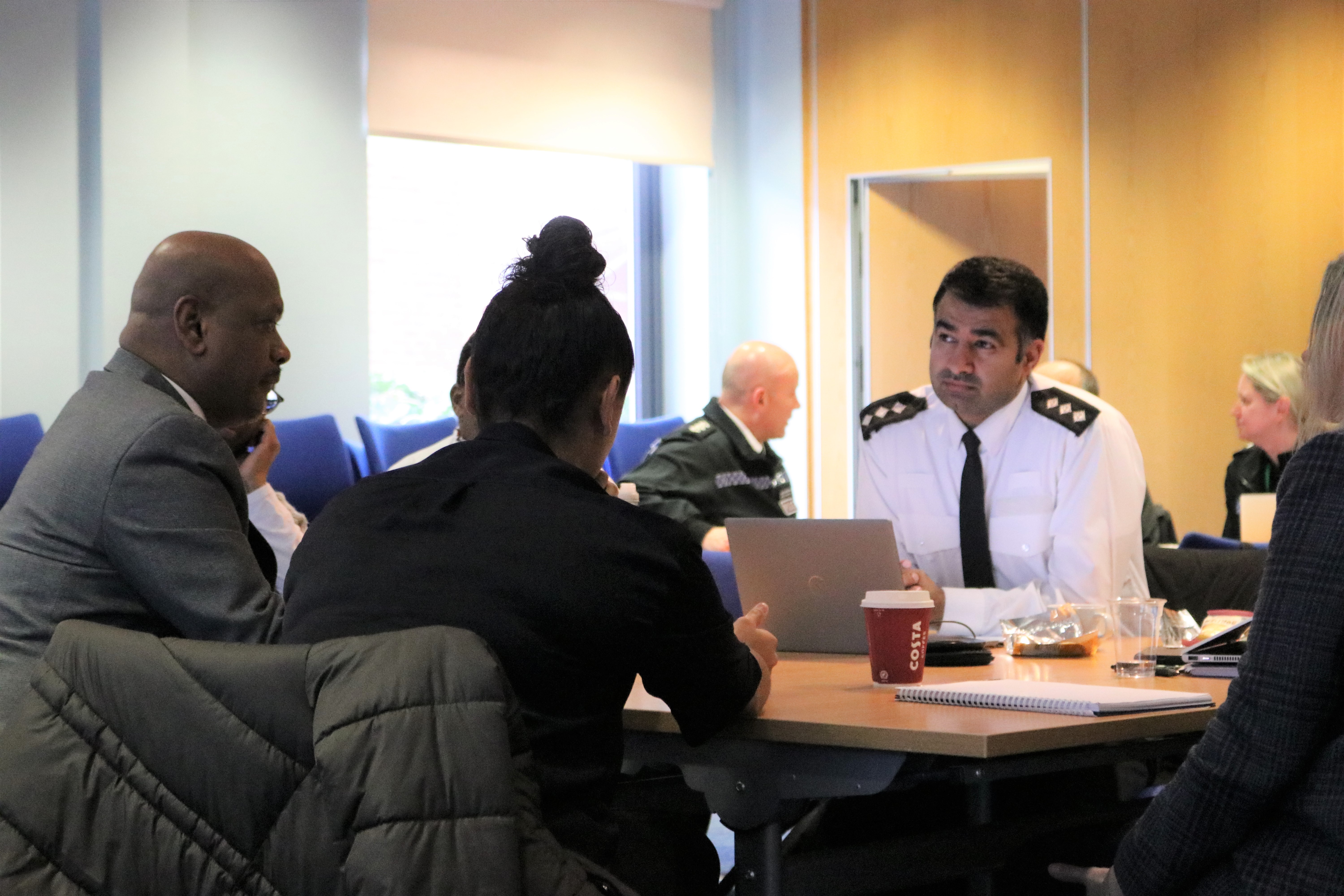 Officers and Race Inclusion Board members discuss issues related to stop and search at Police Headquarters in Welwyn Garden City