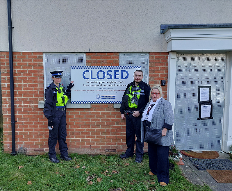 officers next to the closure sign