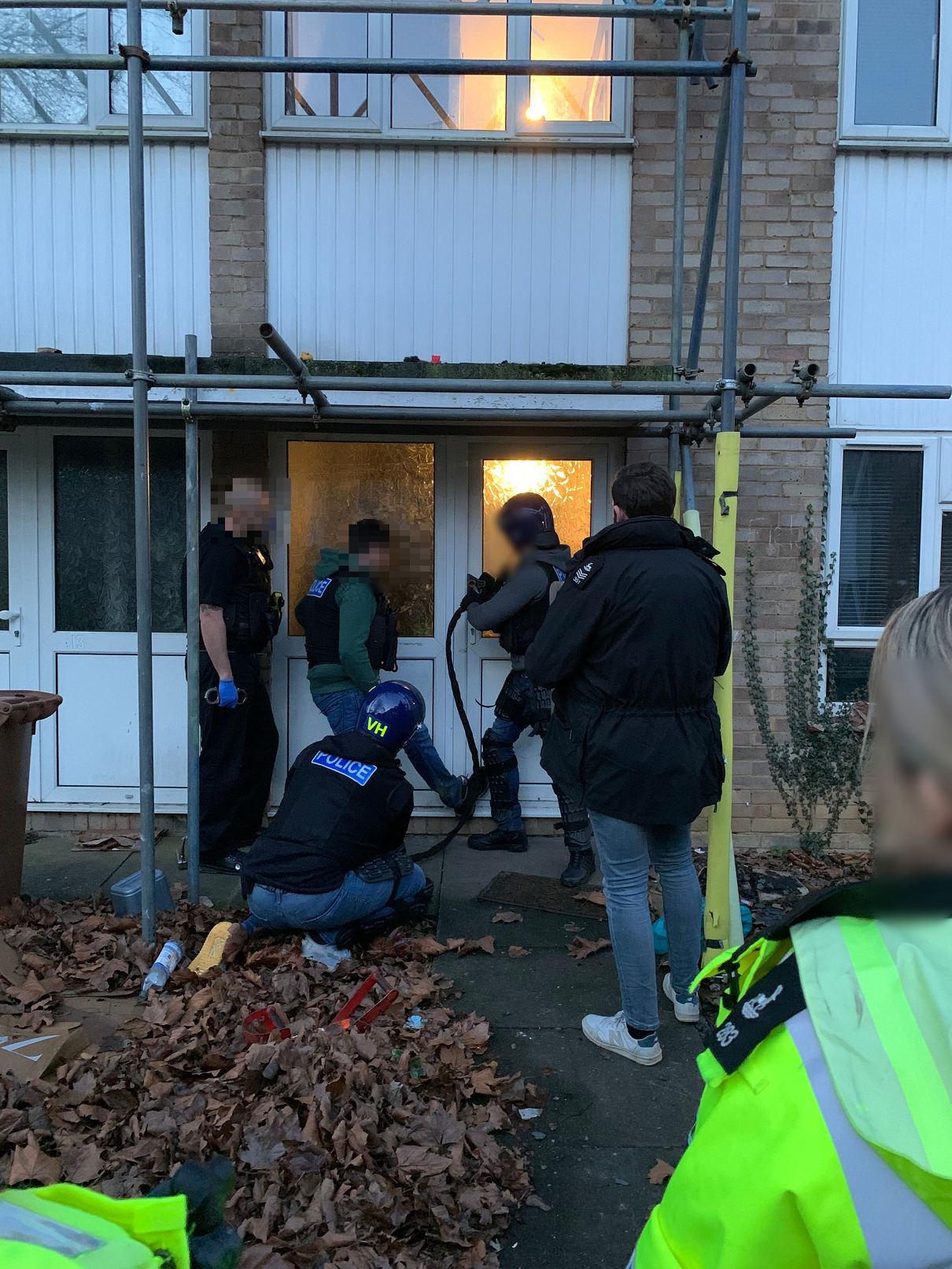 Officers entering the property