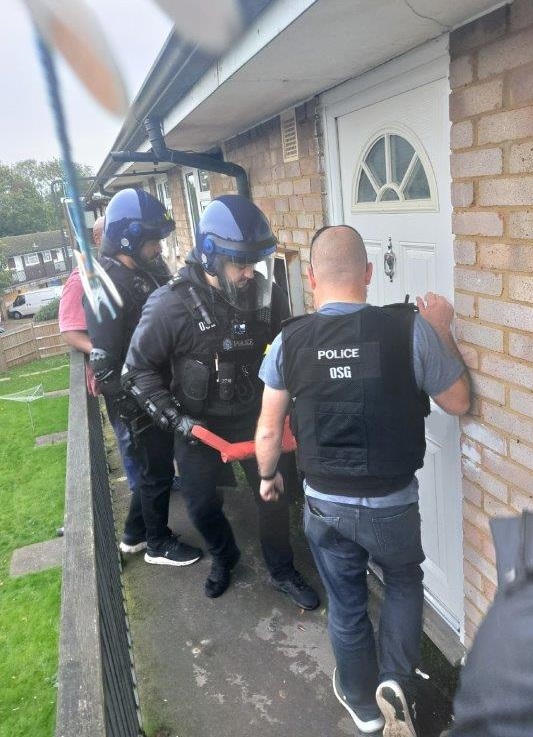 Image of officers conducting the warrant