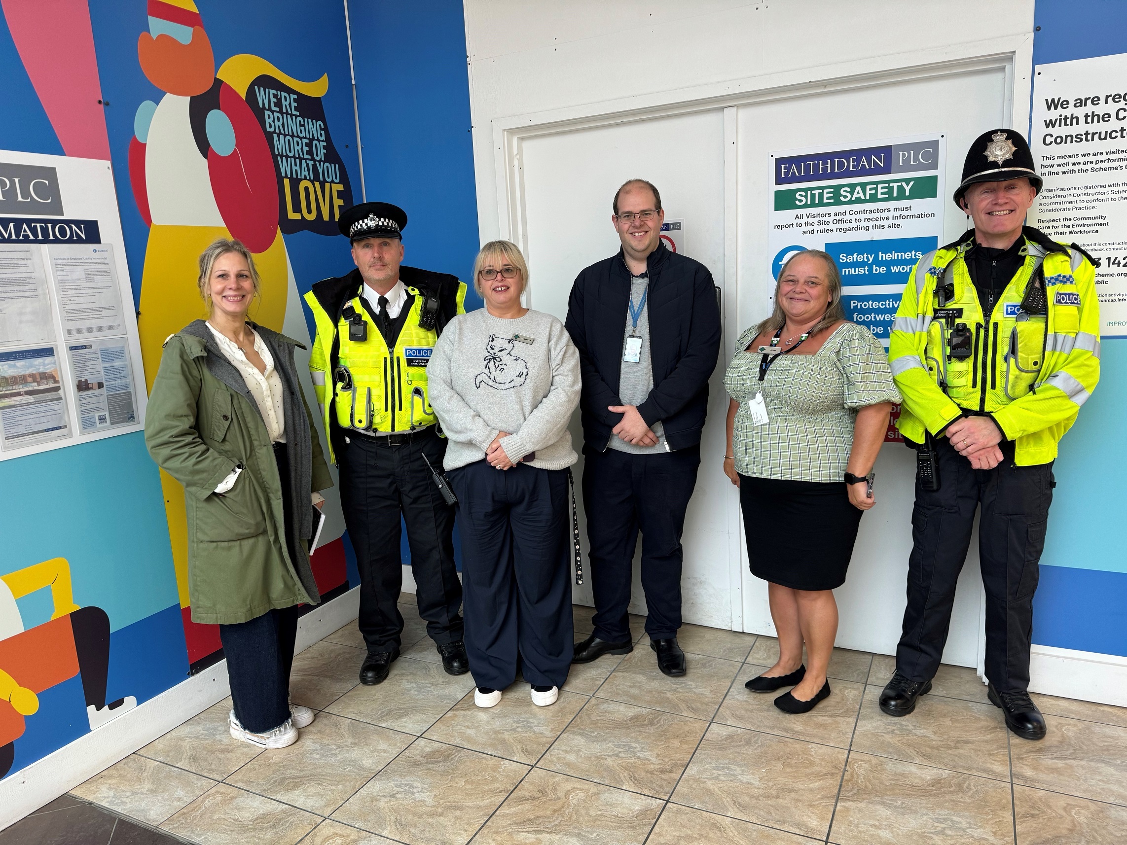 Image of police officers with Police and Crime Commissioner and shopping centre staff members
