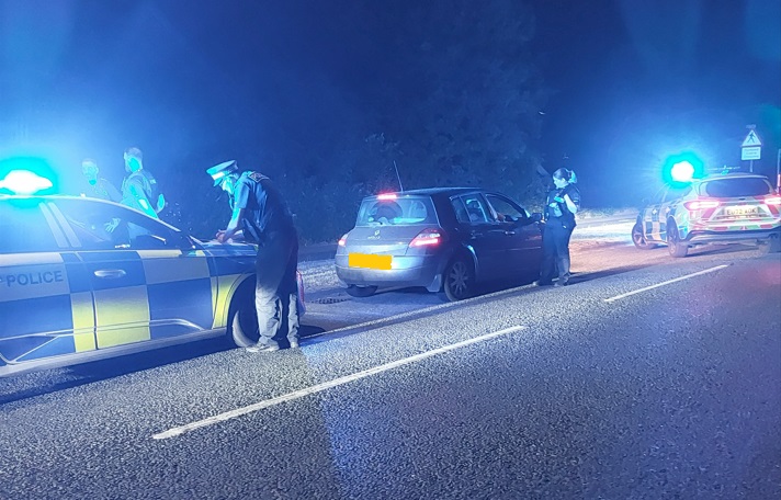 Photo of officers and police cars during the operation