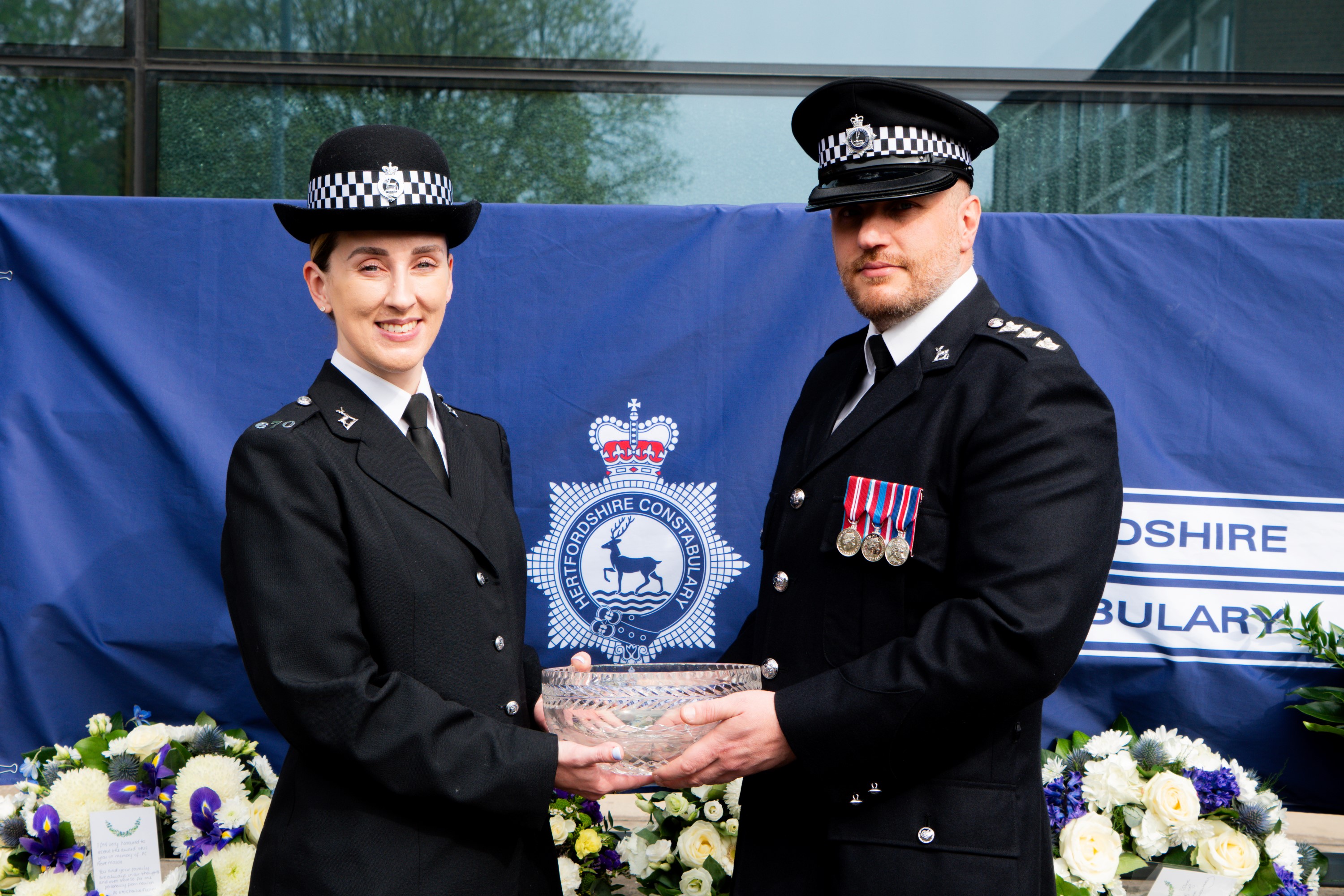 PC Charlie Fuller recieving the award from Chief Inspector Paul Stanbridge