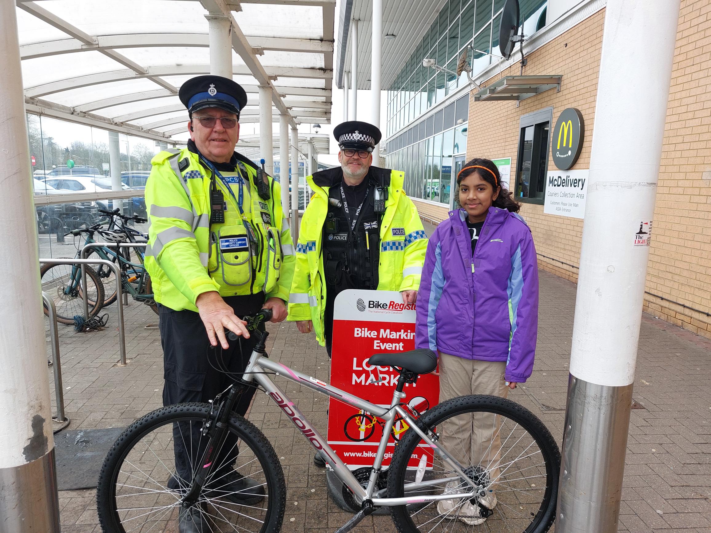 pcso bill, special sergeant steve and a young girl with her bike