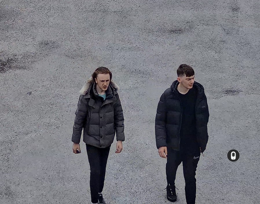Two men in all black clothing 