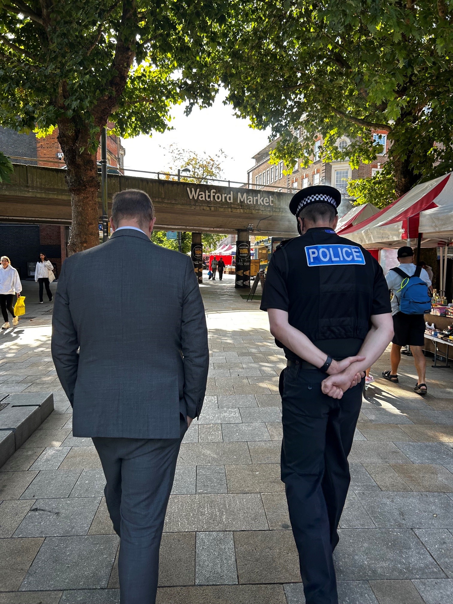 Image of PCC and Chief Constable walking in Watford town centre